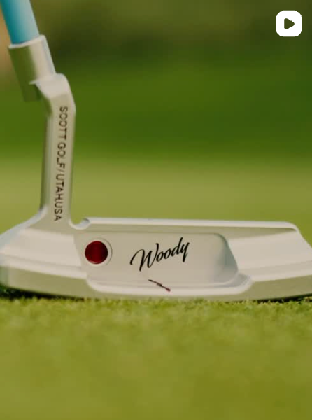 The Woody Putter by Scott Golf with a wooden inlay and red accent.