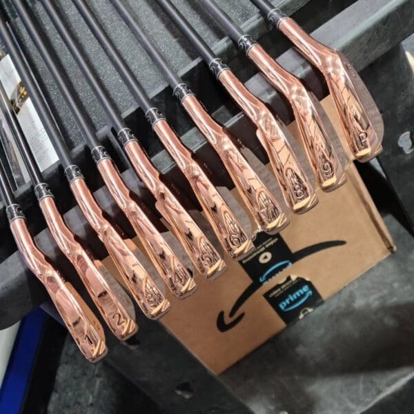 Close-up of golf clubs on display